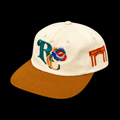 Casquette RC Cauris écrue de face sur fond noir