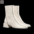 Paire de bottines Idealo blanches à coutures noires sur fond noir